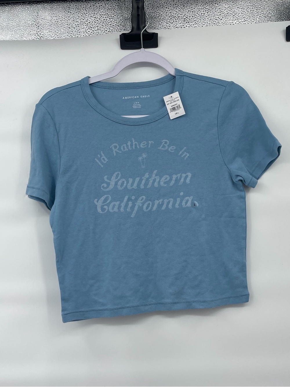 American Eagle nwt “I’d rather be in southern California” blue crop top